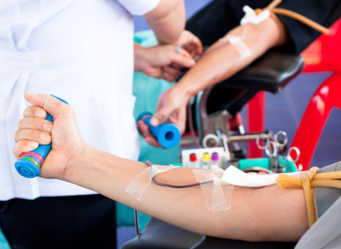 arm of a donor donating blood at hemotransfusion station