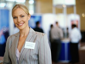 portrait of a businesswoman smiling at an exhibition